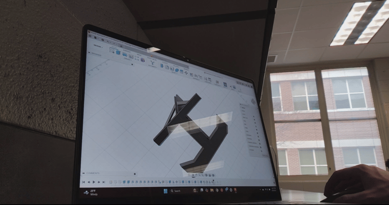 PLTW Student creates custom-fit 3D printed dividers to organize the sports bins.