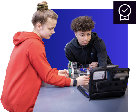 Two PLTW students collaborating on hands-on activity