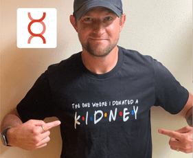 Larry Sickles pointing to a t-shirt that reads, 