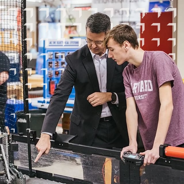 PLTW CEO Dave Dimmett in a PLTW Engineering class with a high school student