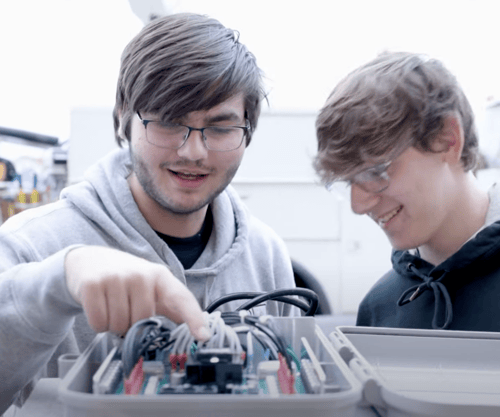 Two computer science students working on project