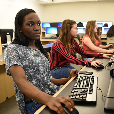 A PLTW student using a computer