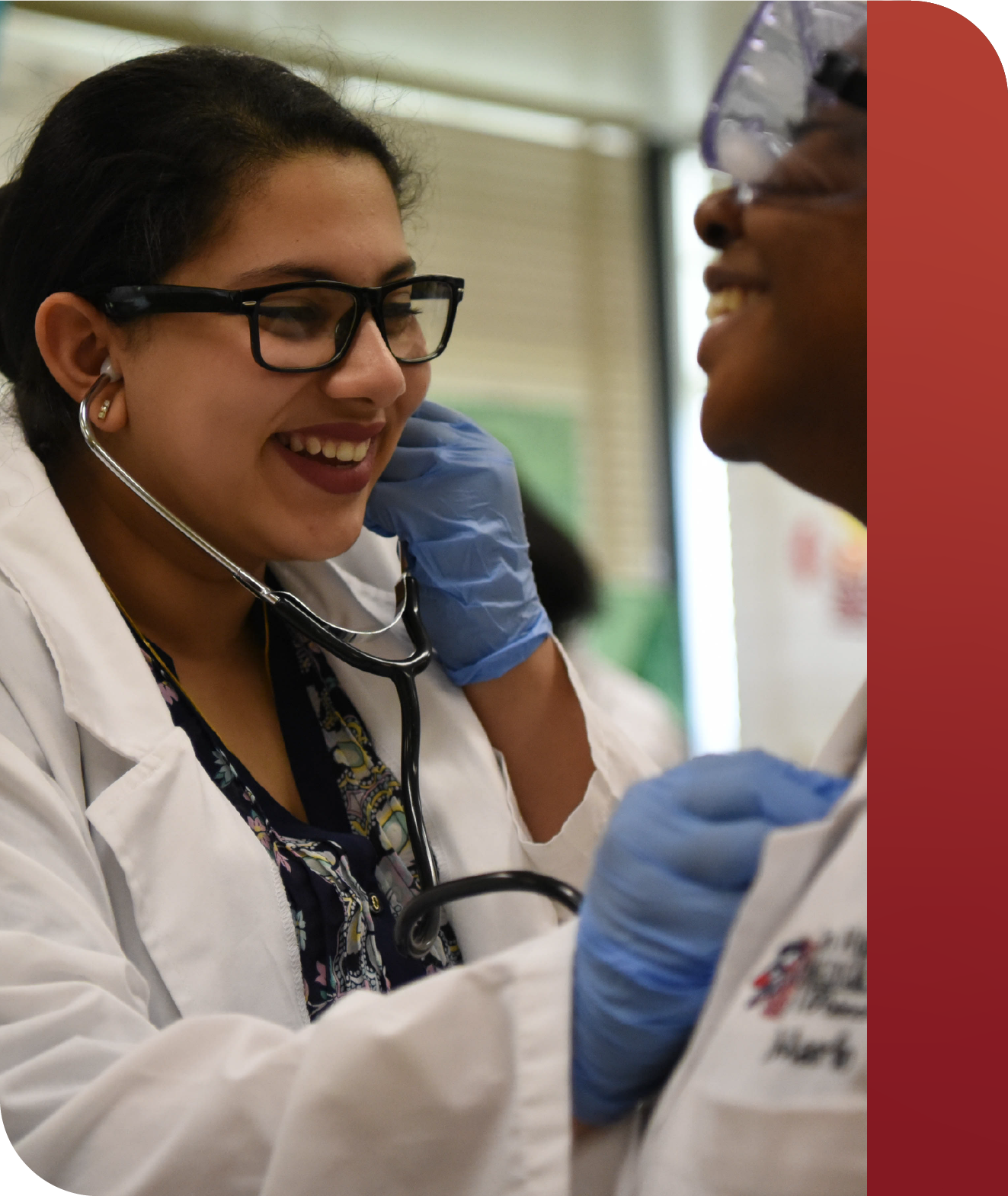 Two PLTW students with a stethoscope