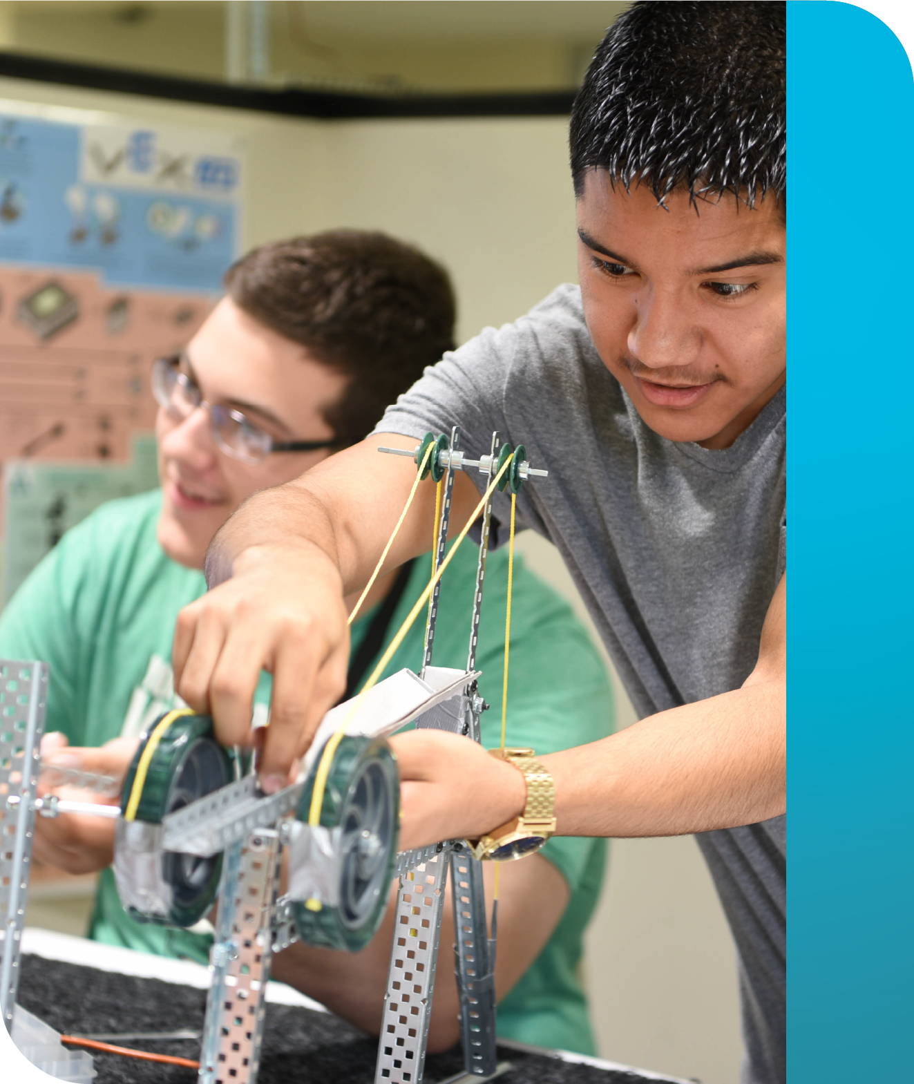 Two PLTW Engineering students building equipment