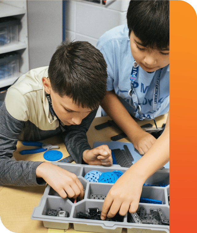 Two PLTW kids focusing on work