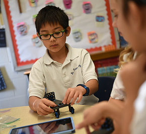 A PLTW student working on a hands on activity