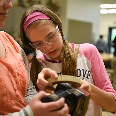 Two PLTW students engaged in a hands on activity