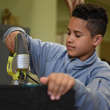 PLTW student using STEM equipment 