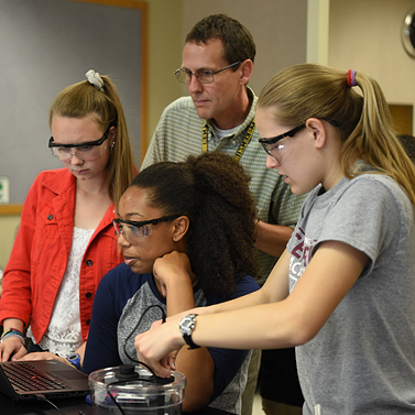 PLTW teacher directs students during an activity