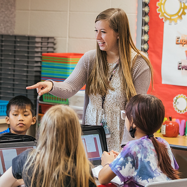 PLTW teacher directs students during an activity