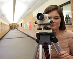 High school girl using engineering instrument