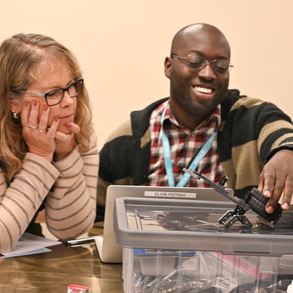 Two PLTW teachers work together on an activity